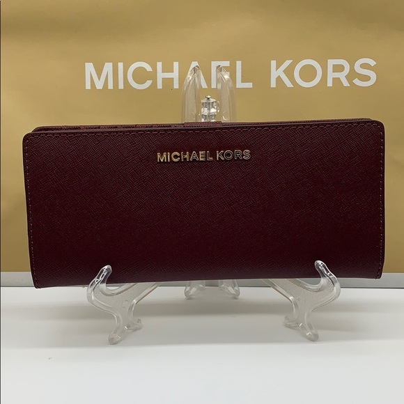Michael Kors Handbags - Michael Kors Jet Set Travel Md Flt Slm Bfld Merlot